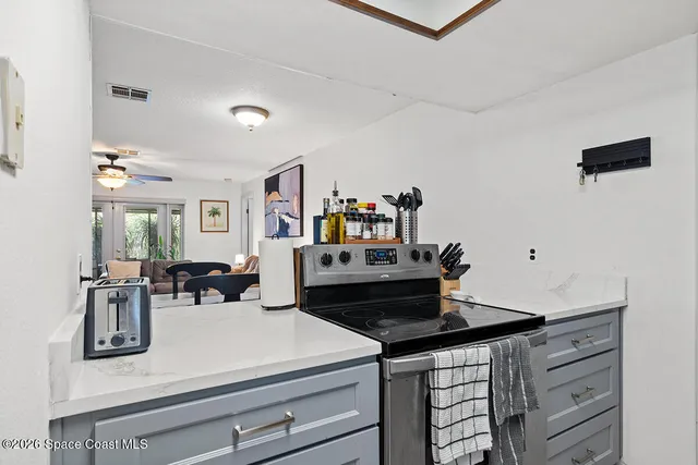 a kitchen with a stove and a refrigerator
