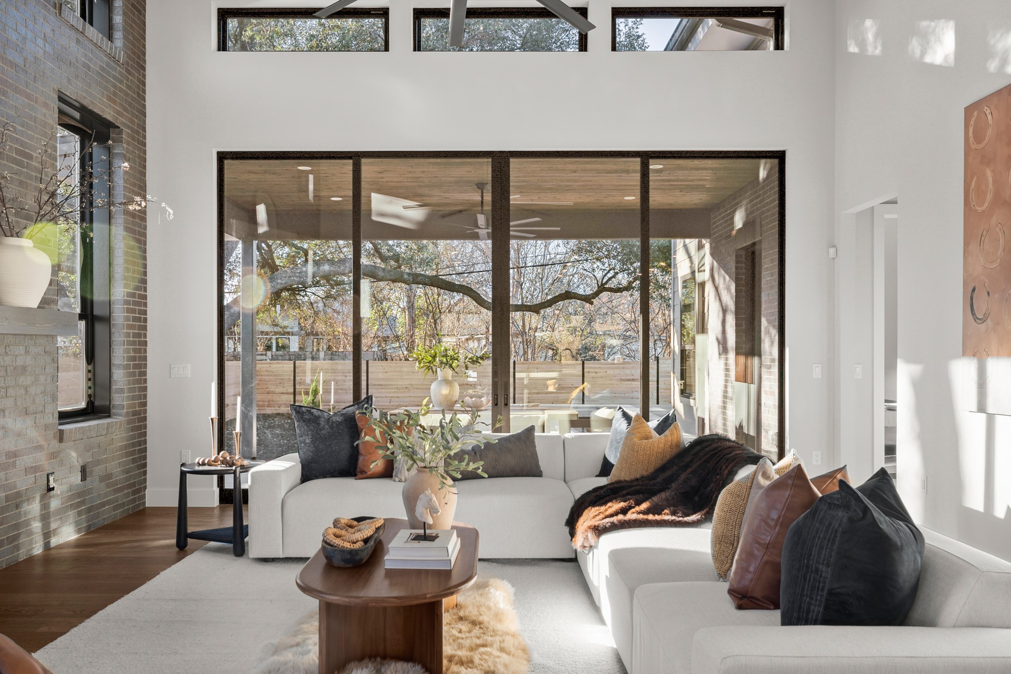 7706 Rutgers Avenue Austin, TX 78757 - Photo 25 of 35 Living area with healthy amount of natural light, wood finished floors, and a high ceiling