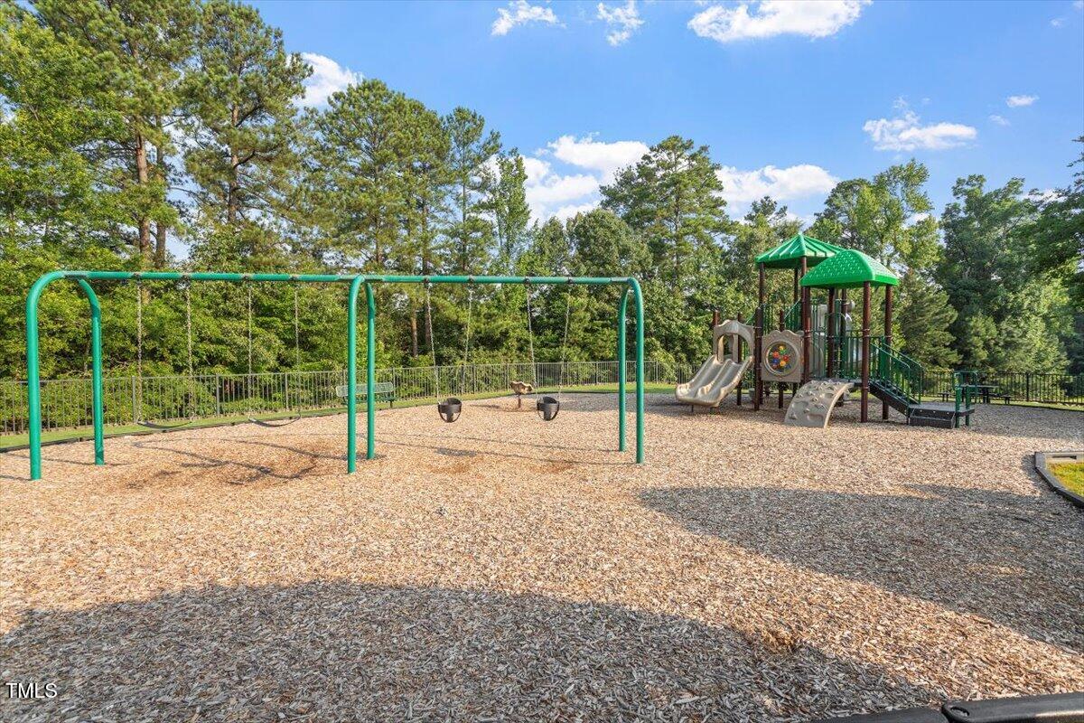 7414 Brandon Allen Avenue Raleigh, NC 27613 - Photo 52 of 57 a view of a park with slide
