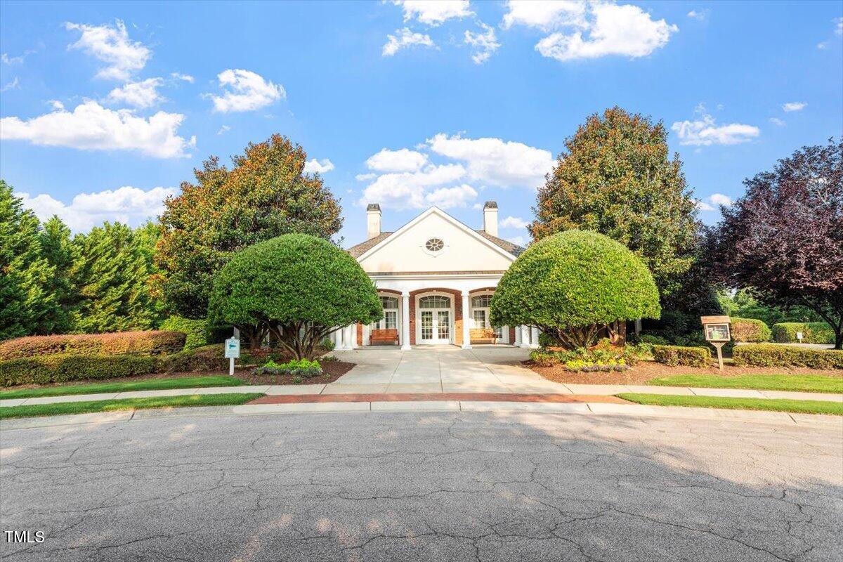 7414 Brandon Allen Avenue Raleigh, NC 27613 - Photo 55 of 57 a front view of a house with a yard and a garage