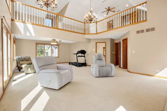 a view of a livingroom with furniture and a ceiling fan