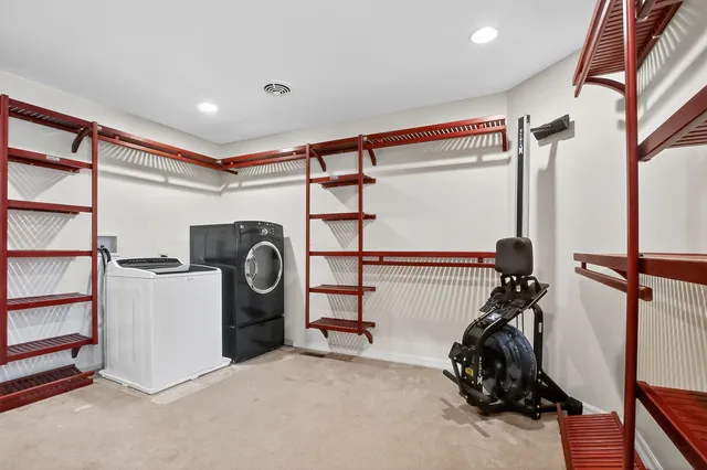 a view of a hallway with windows and stairs