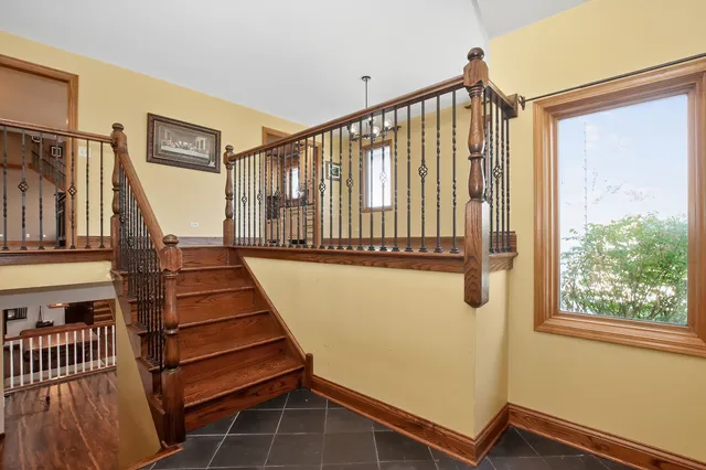 a view of an livingroom with wooden floor and a floor to ceiling window