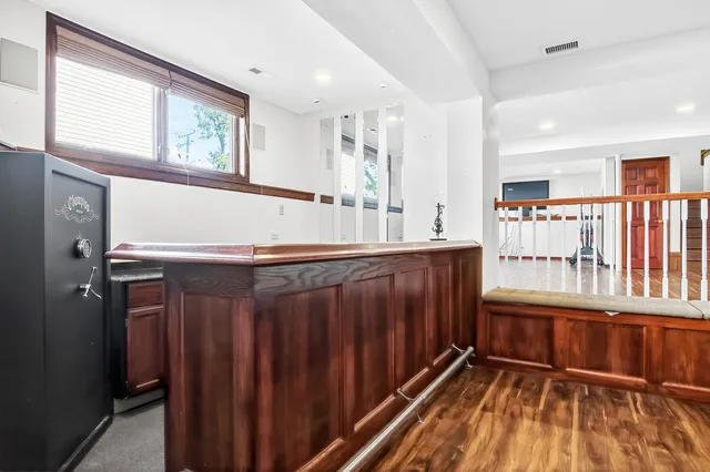 an aerial view of a house with a yard and plants