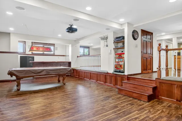 an aerial view of a house with outdoor space pool seating area and yard