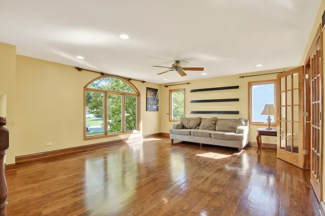 a view of a livingroom with furniture wooden floor and a window