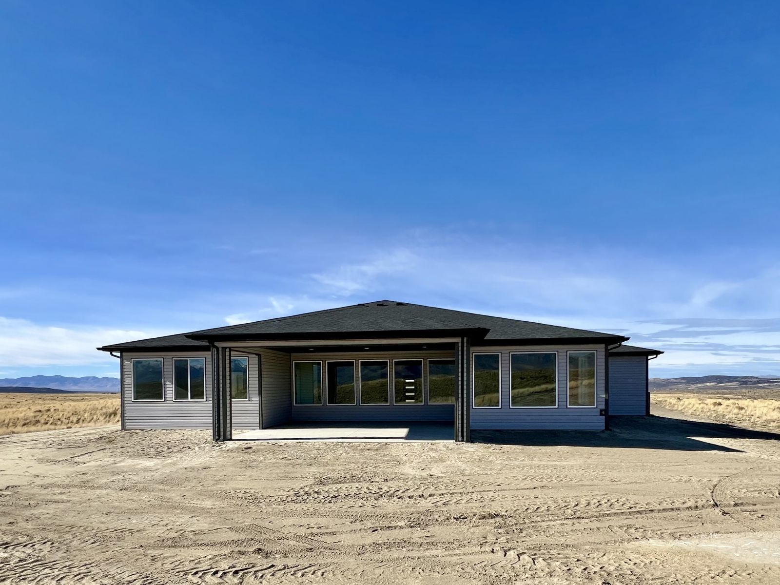 1597 Sun Vly Road, Unit C7 Spring Creek, NV 89815 - Photo 39 of 43 a front view of a house with a yard
