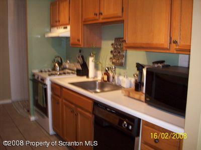 1407 Summit Pointe Scranton, PA 18508 - Photo 3 of 11 a kitchen with stainless steel appliances granite countertop a sink a stove and a microwave