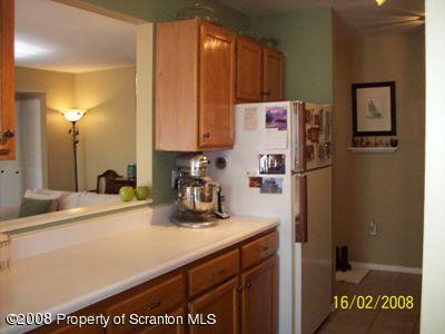 1407 Summit Pointe Scranton, PA 18508 - Photo 4 of 11 a kitchen with a refrigerator and a sink