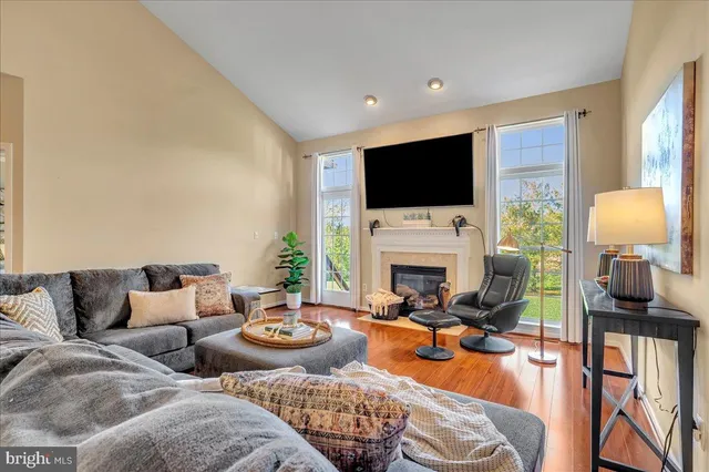 a living room with furniture fireplace and a flat screen tv