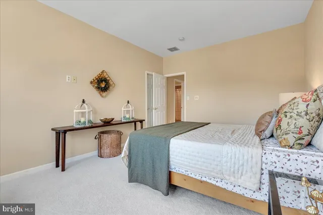 a bedroom with a bed and dresser