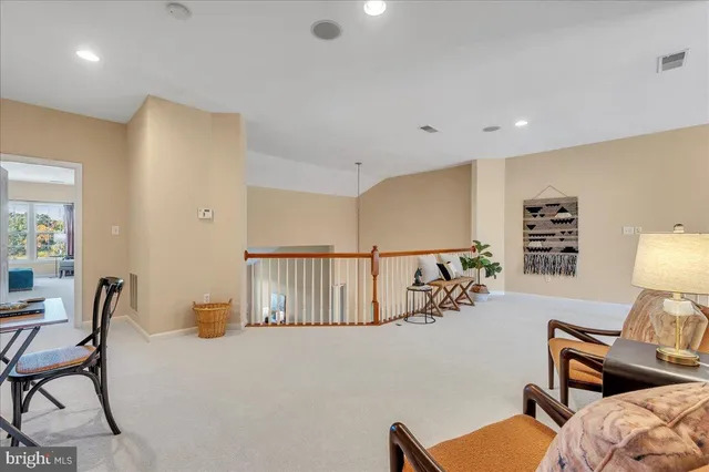 a bed room with furniture and a wooden floor