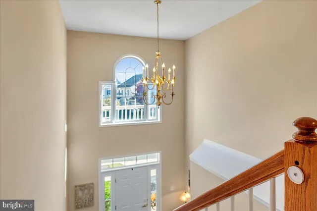 a view of a hallway with a chandelier