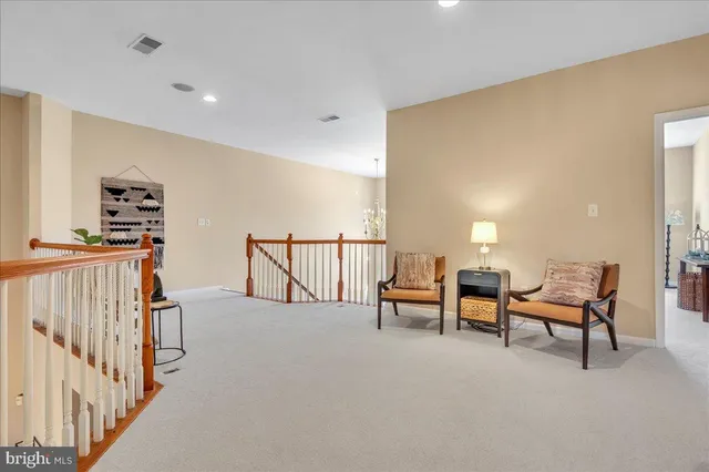 a view of a livingroom with furniture and lounge chair