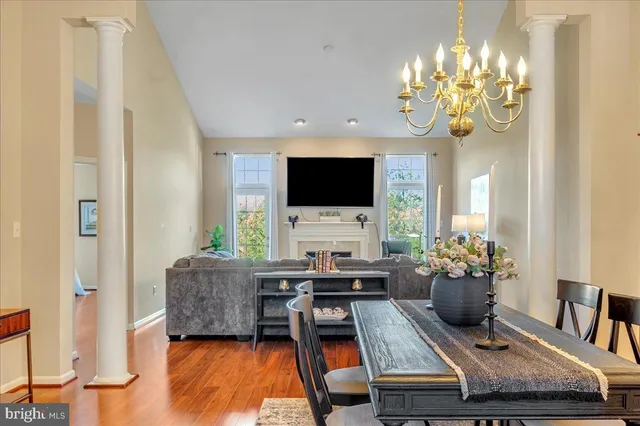 a living room with fireplace furniture and a flat screen tv