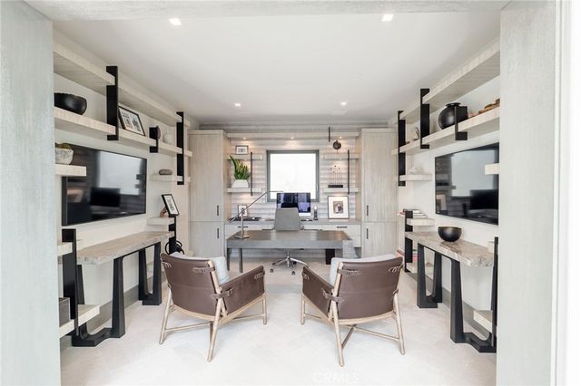 a bedroom with a bed and glass door