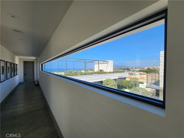 an aerial view of residential building and ocean view