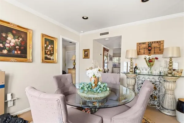 a dining room with furniture and window