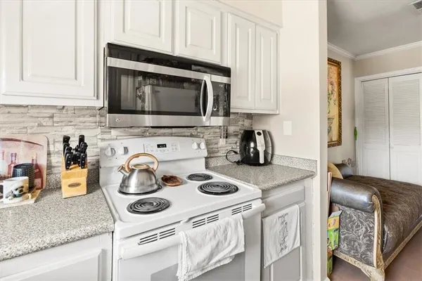 a kitchen with a stove and a microwave