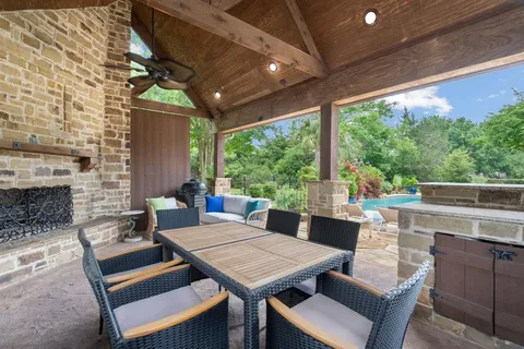 a outdoor space with a table and chairs