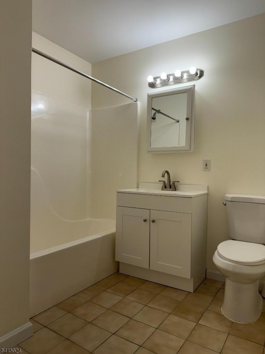 5 Chanda Court, Unit 5 Clifton, NJ 07012 - Photo 11 of 15 a bathroom with a sink a toilet and a mirror