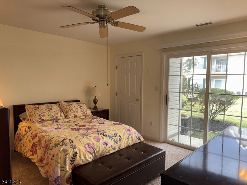 5 Chanda Court, Unit 5 Clifton, NJ 07012 - Photo 12 of 15 a bed sitting in a bedroom next to a window