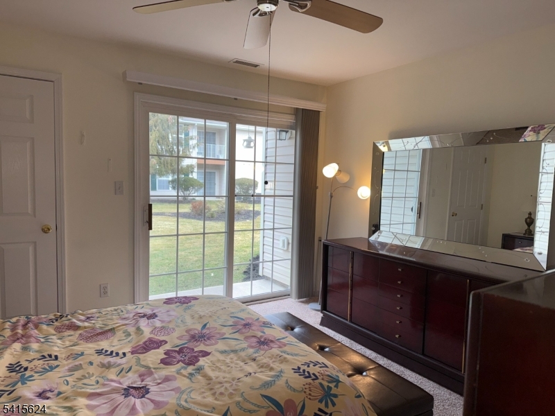 5 Chanda Court, Unit 5 Clifton, NJ 07012 - Photo 13 of 15 a bedroom with a bed and a dresser