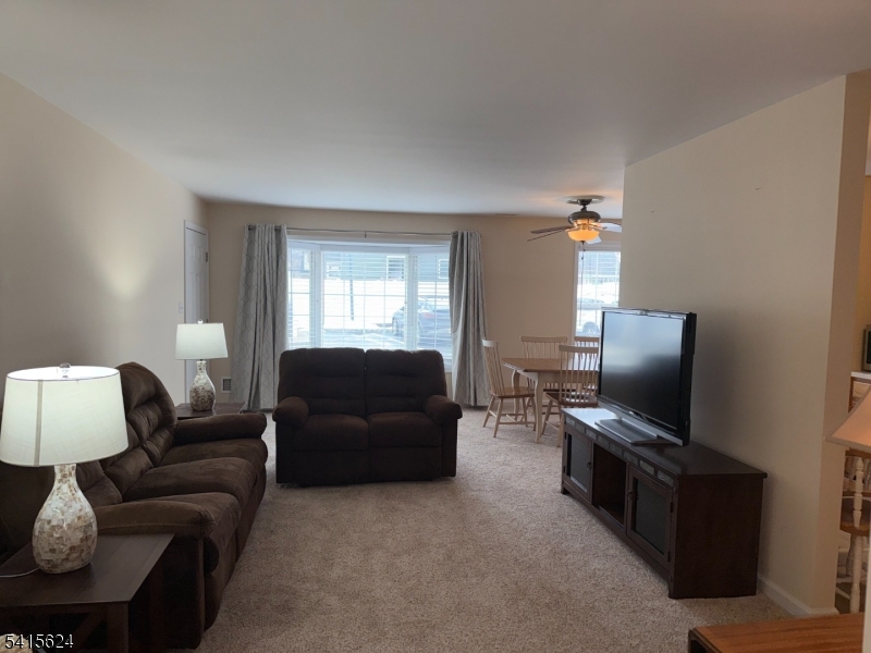 5 Chanda Court, Unit 5 Clifton, NJ 07012 - Photo 3 of 15 a living room with furniture and a flat screen tv