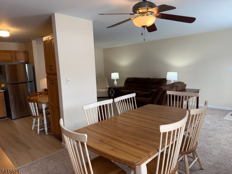 5 Chanda Court, Unit 5 Clifton, NJ 07012 - Photo 5 of 15 a view of a dining room with furniture and chandelier