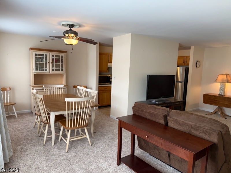 5 Chanda Court, Unit 5 Clifton, NJ 07012 - Photo 10 of 15 a bedroom with a bed and a flat screen tv