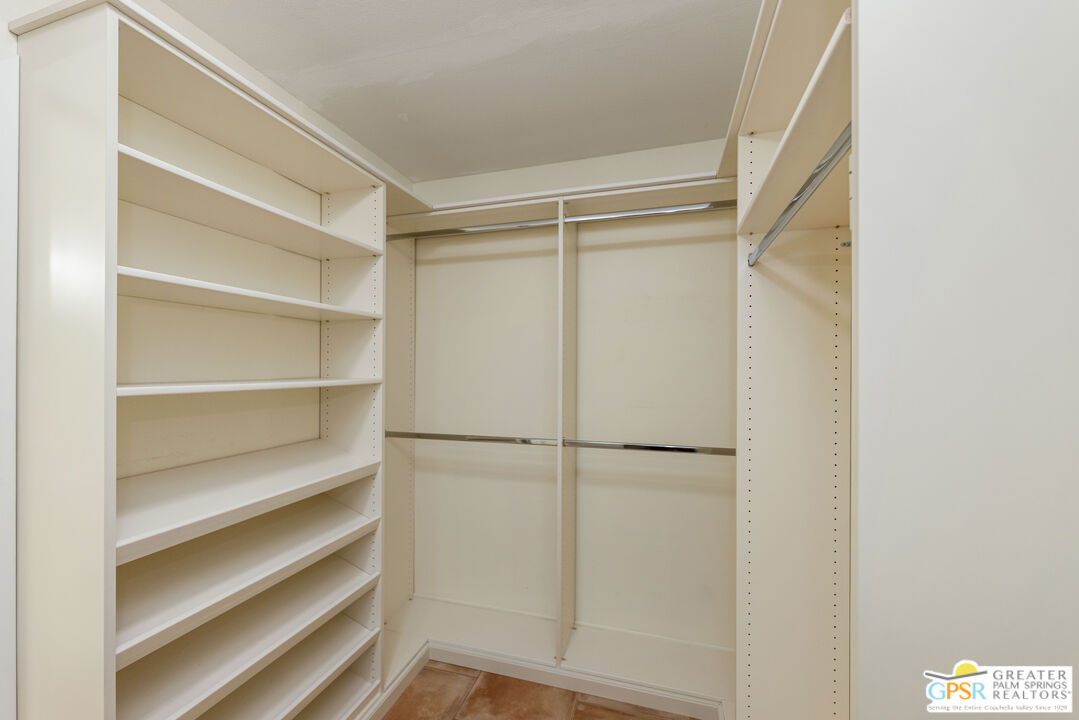 6090 East Driver Road Palm Springs, CA 92264 - Photo 28 of 29 a view of walk in closet with empty racks