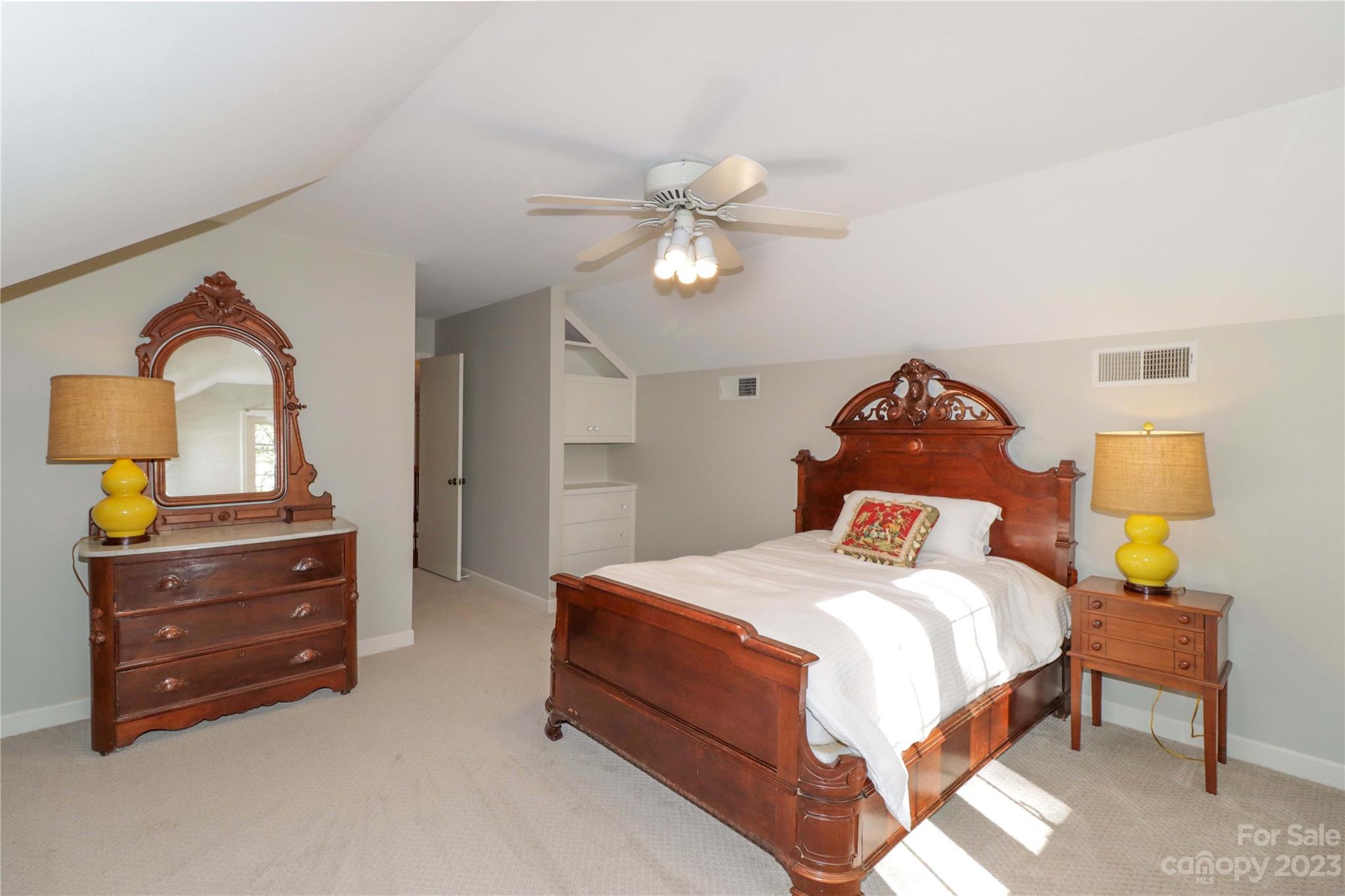 802 Fieldstone Road Mooresville, NC 28115 - Photo 35 of 47 a bedroom with a bed and a chandelier