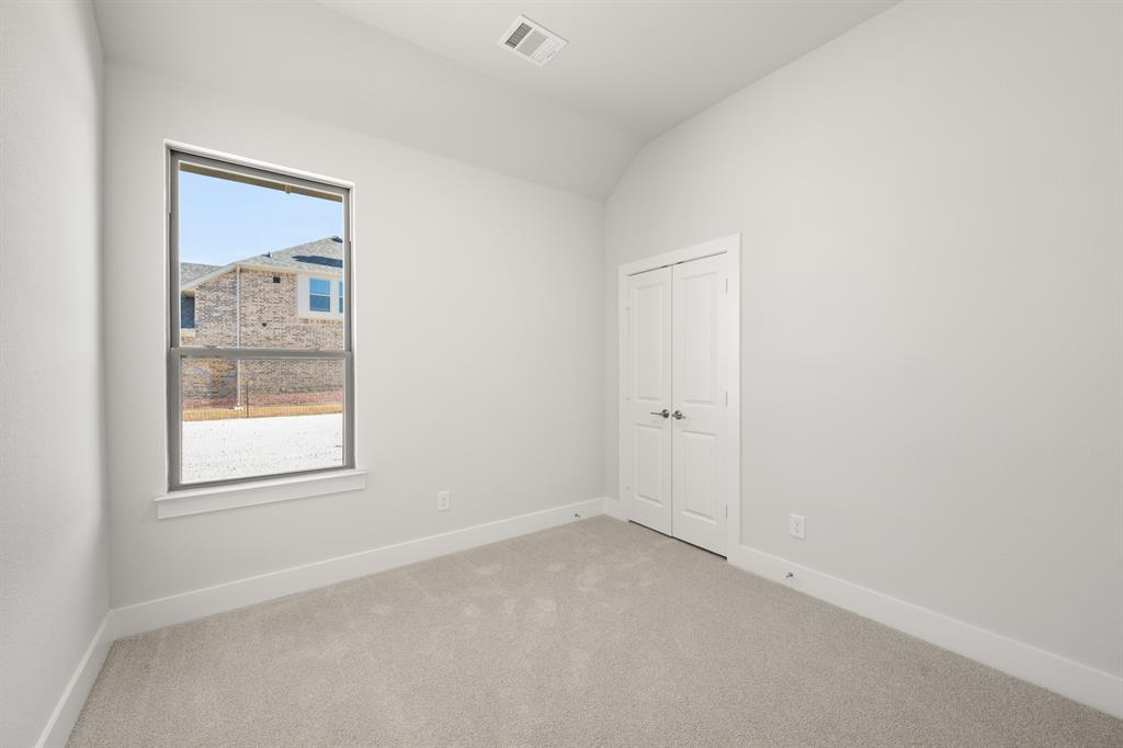 478 Red Maple Road Waxahachie, TX 75165 - Photo 18 of 27 an empty room with a window