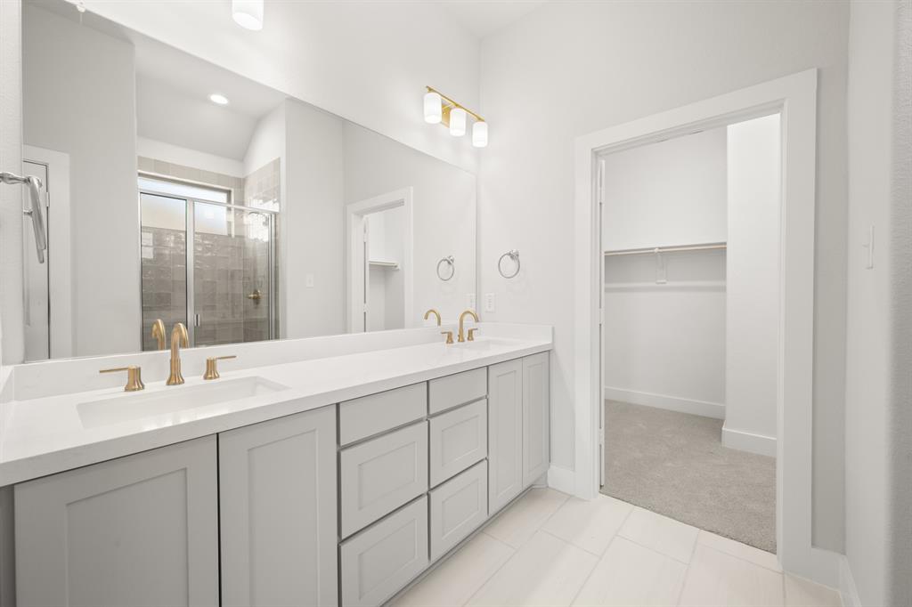 478 Red Maple Road Waxahachie, TX 75165 - Photo 21 of 27 a bathroom with double sink and a mirror