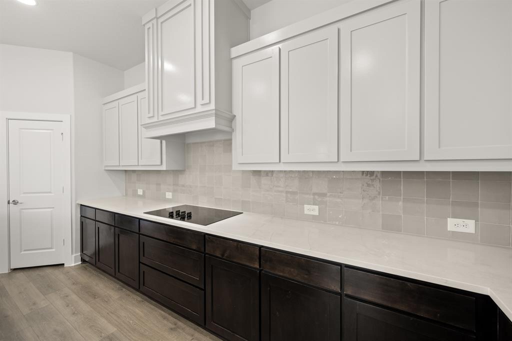 478 Red Maple Road Waxahachie, TX 75165 - Photo 8 of 27 a kitchen with stainless steel appliances granite countertop white cabinets and sink