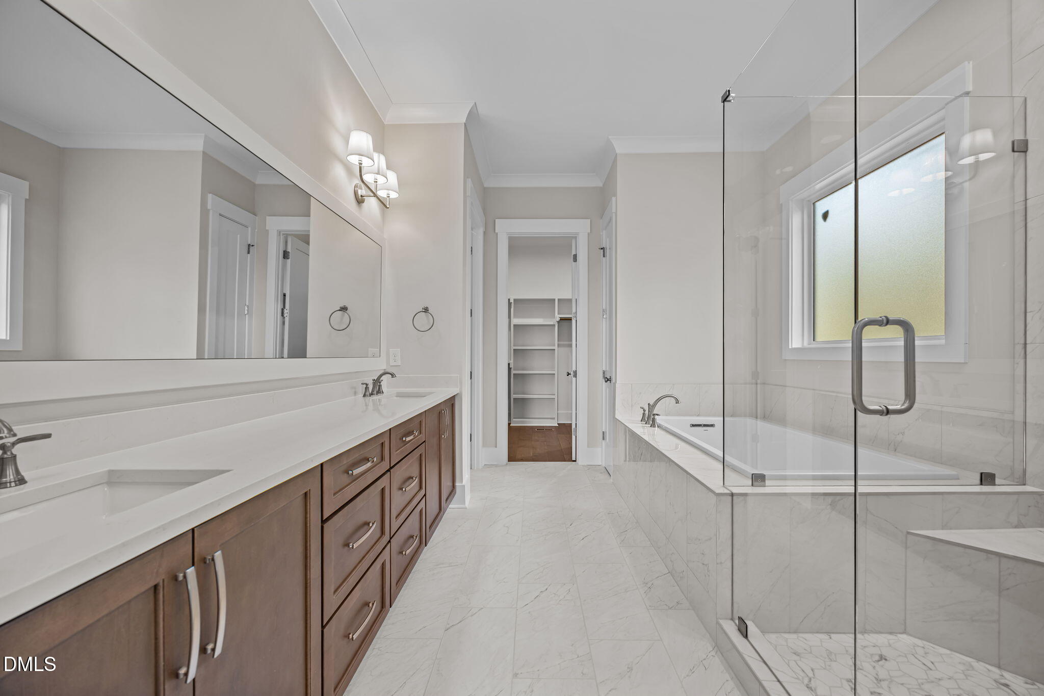 485 Chapel Ridge Drive Pittsboro, NC 27312 - Photo 22 of 74 a bathroom with a double vanity sink a large mirror and shower