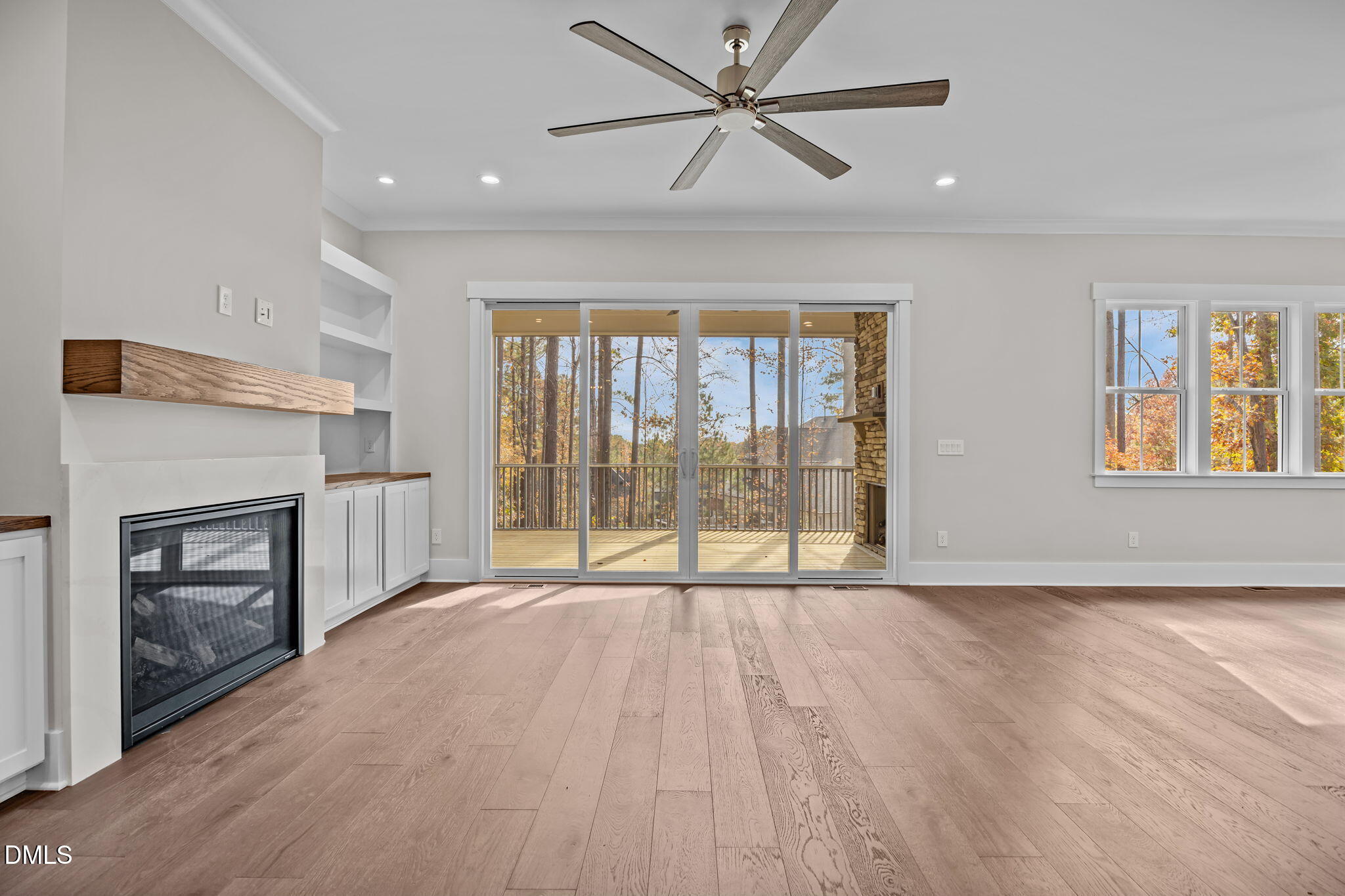 485 Chapel Ridge Drive Pittsboro, NC 27312 - Photo 29 of 74 a view of an empty room with a fireplace and a window