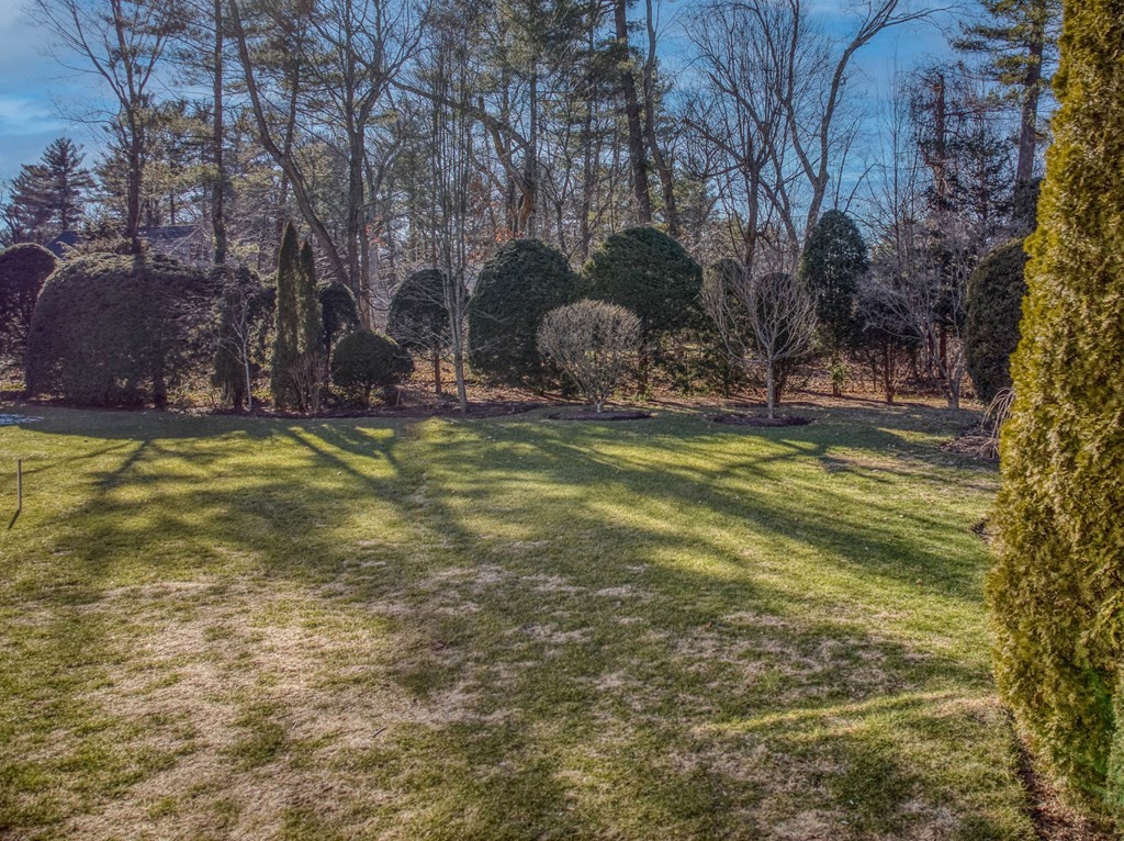 244 Independence Road Concord, MA 01742 - Photo 33 of 37 a view of a swimming pool with an outdoor space and seating area