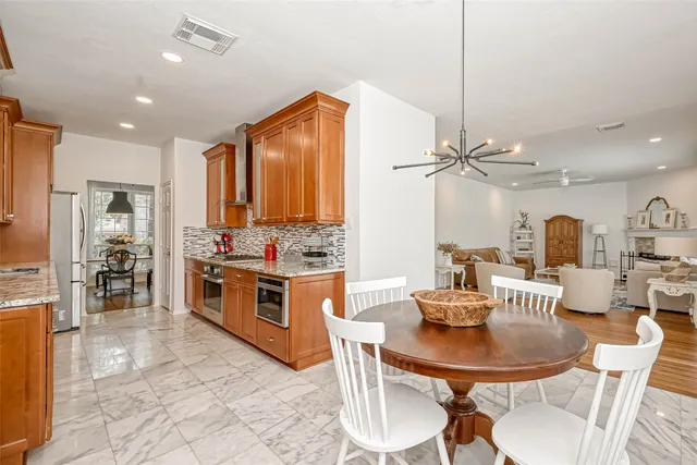 a dining room with furniture and window