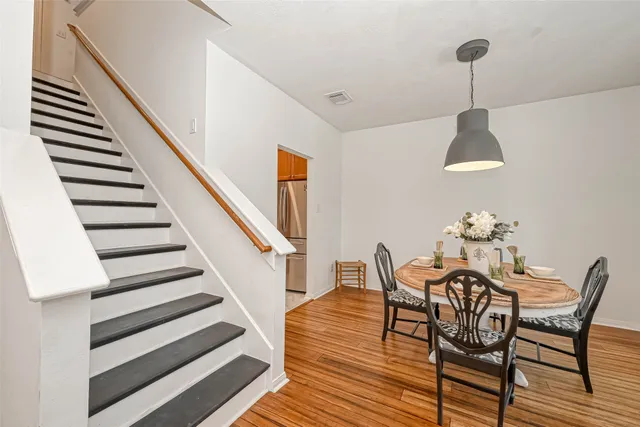 a living room with furniture and a rug