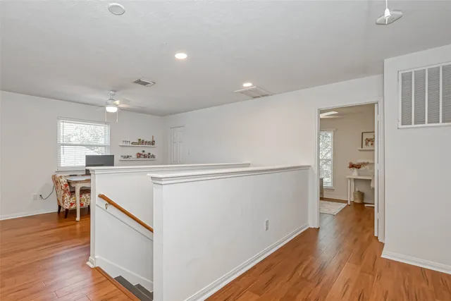 a bathroom with a toilet a sink and a mirror