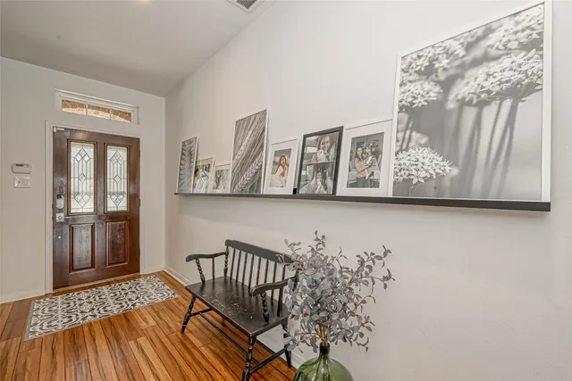a view of a hardwood floor and wardrobe