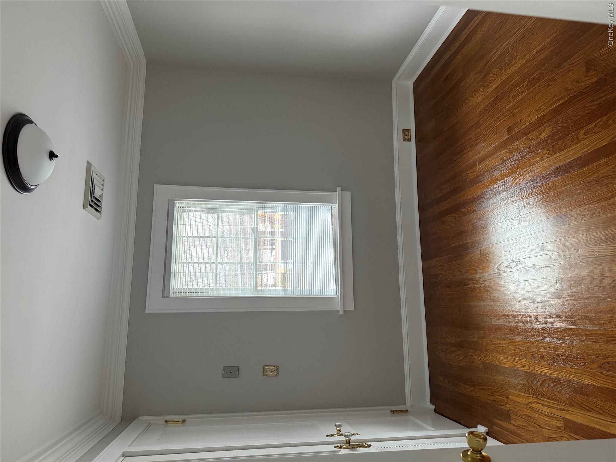 1230 Hopewell Avenue Fishkill, NY 12524 - Photo 11 of 16 an empty room with wooden floor and windows