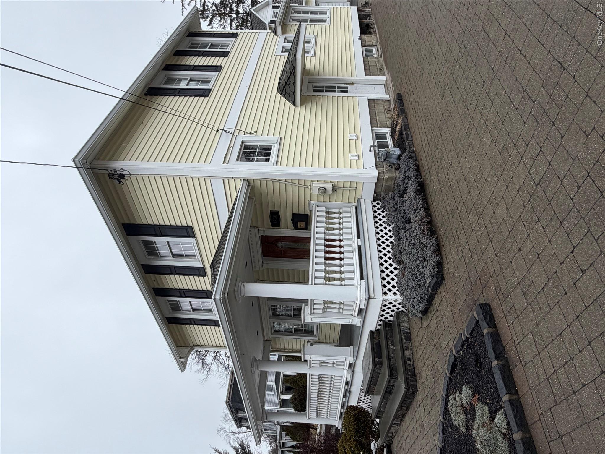 1230 Hopewell Avenue Fishkill, NY 12524 - Photo 2 of 16 a front view of a house with a garage