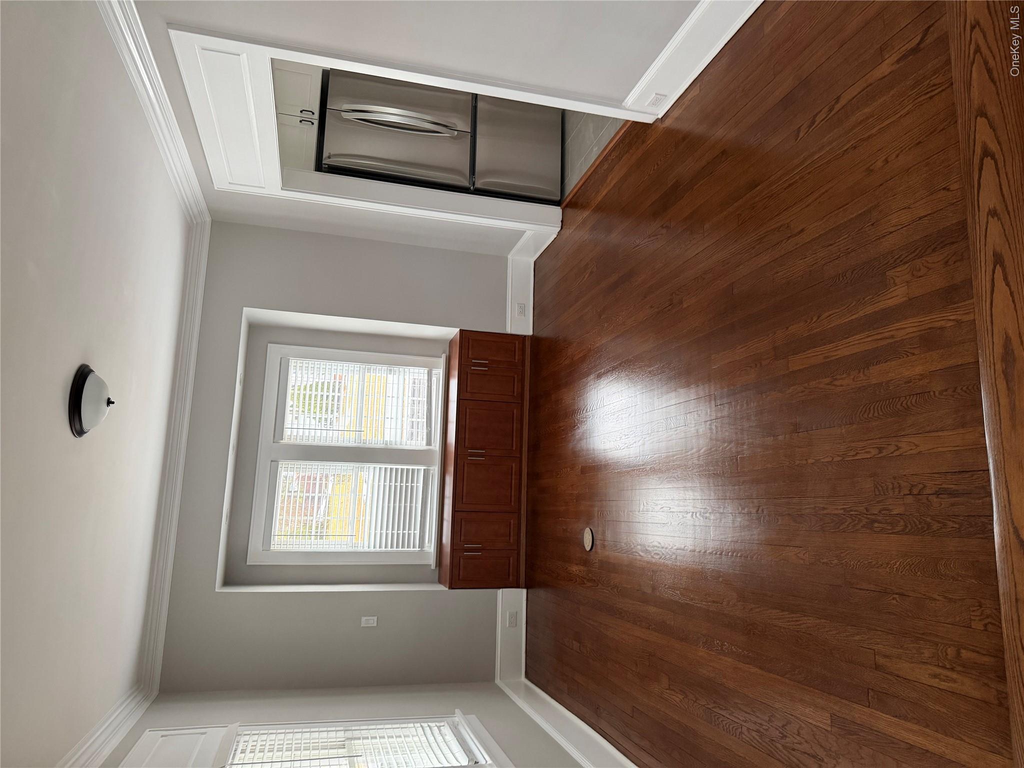1230 Hopewell Avenue Fishkill, NY 12524 - Photo 6 of 16 an empty room with wooden floor and windows