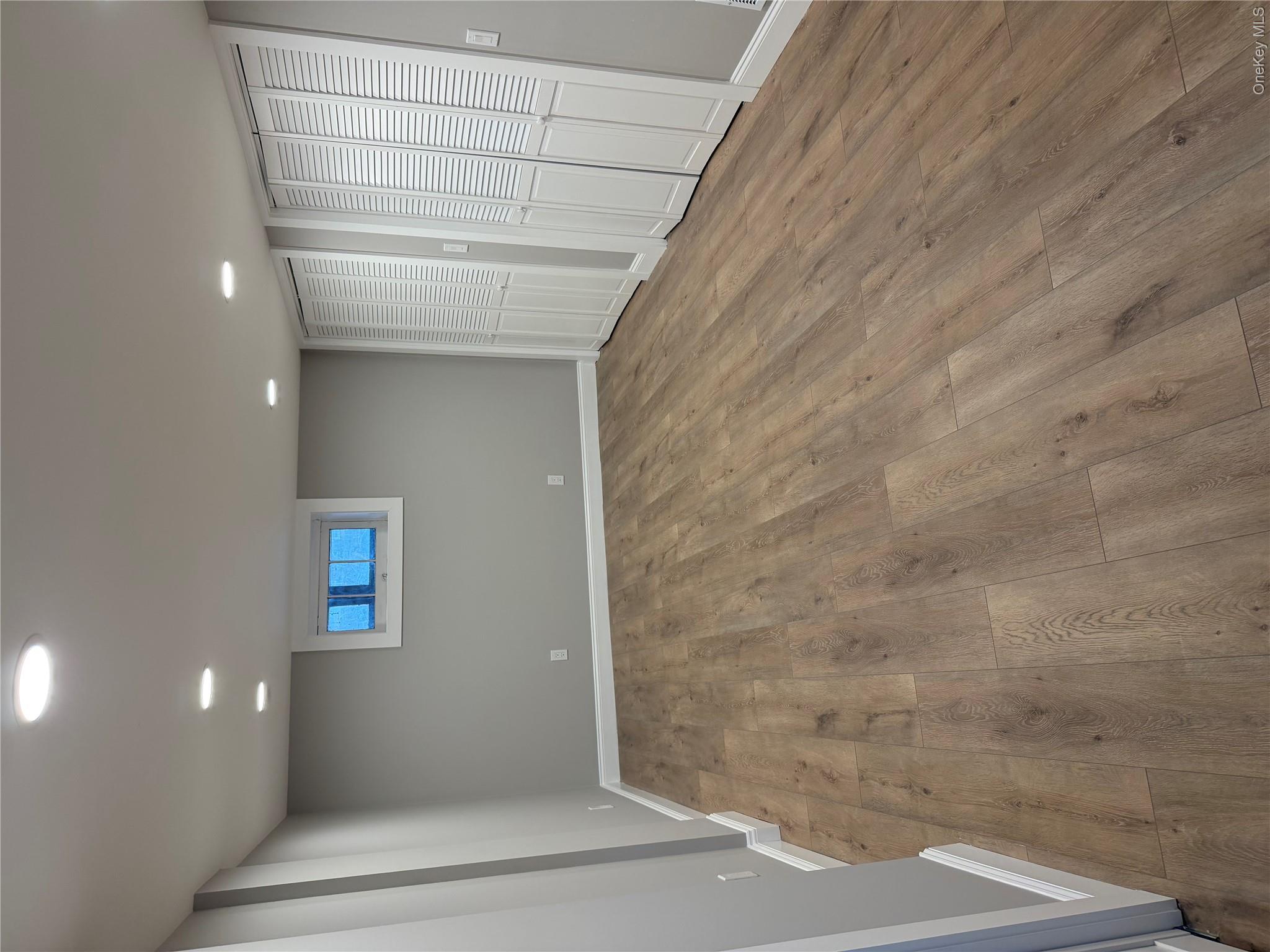 1230 Hopewell Avenue Fishkill, NY 12524 - Photo 7 of 16 an empty room with wooden floor and windows