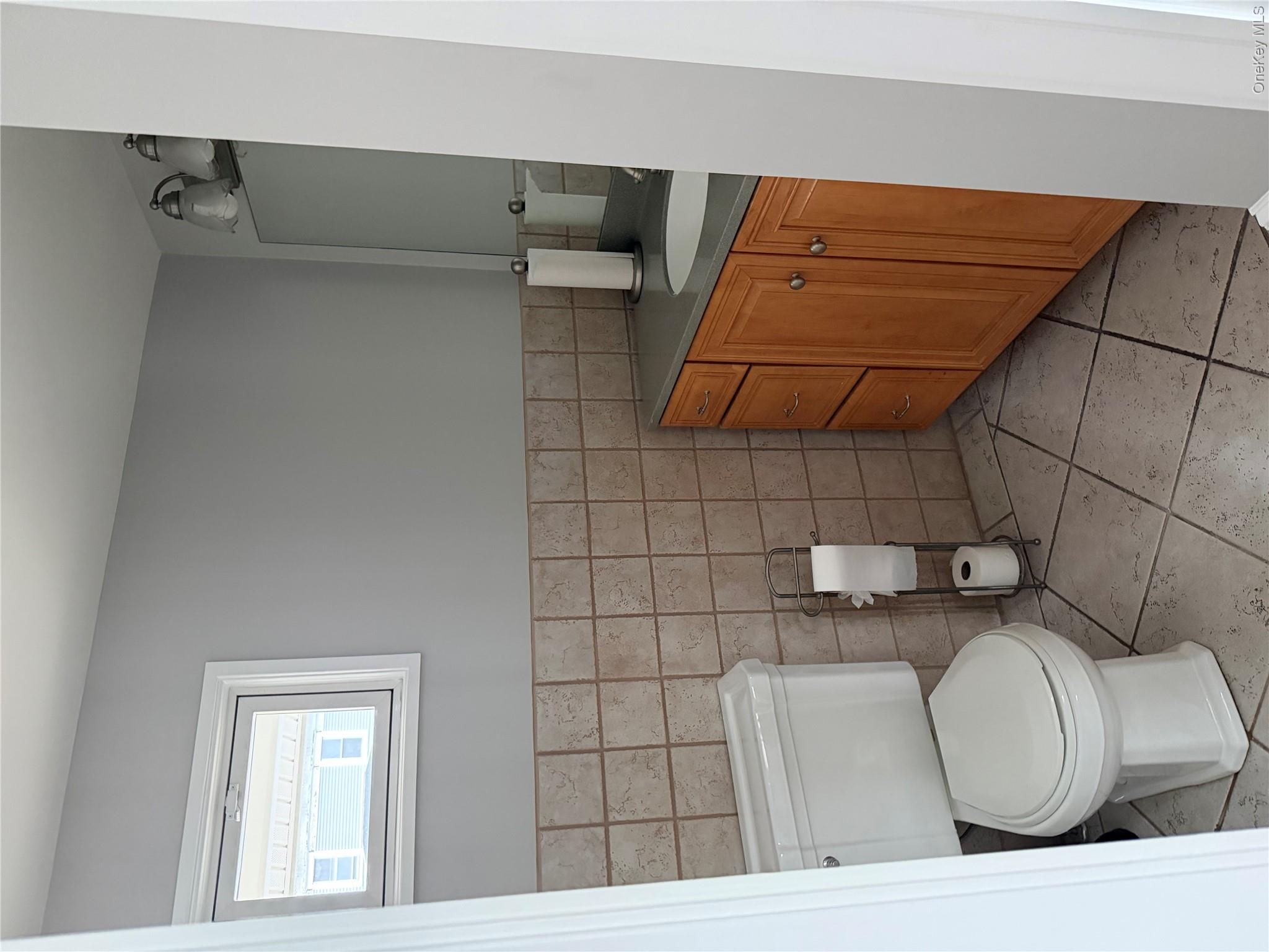 1230 Hopewell Avenue Fishkill, NY 12524 - Photo 8 of 16 a bathroom with a granite countertop toilet and a sink