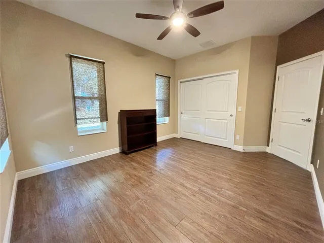 a kitchen with lots of counter top space and stainless steel appliances