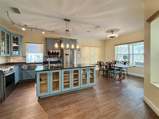 a view of a dining room with furniture and wooden floor