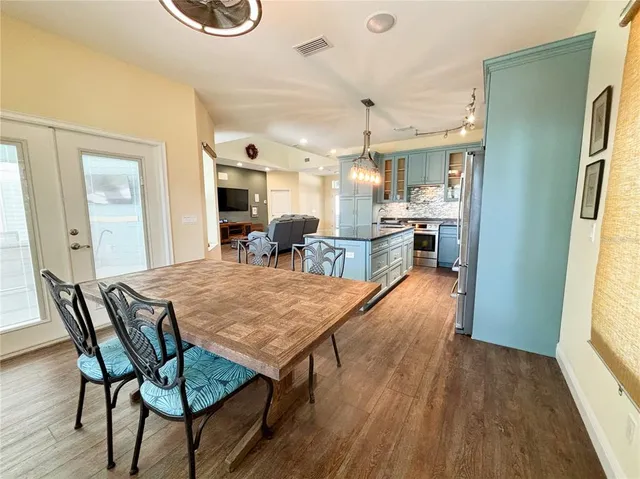 a kitchen with granite countertop a stove and a sink